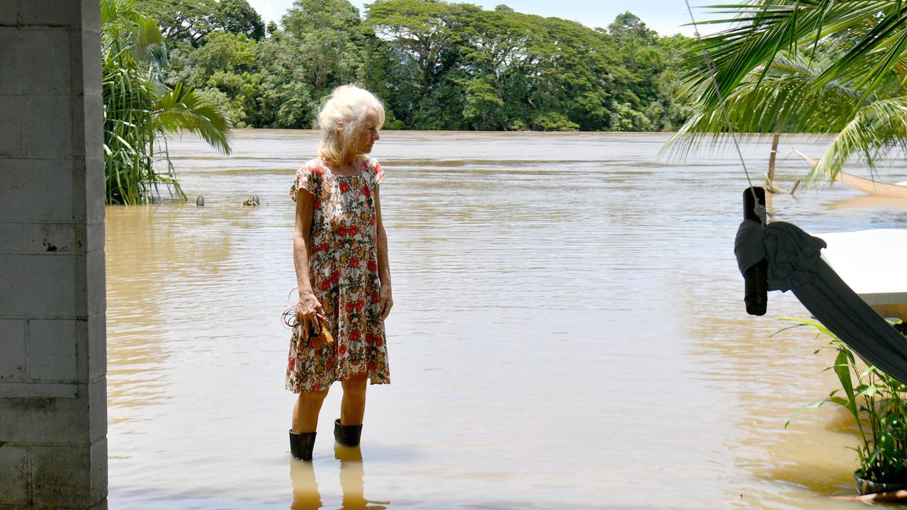 Wednesday February 13. Heavy rain causes flooding in North Queensland. Clean up after flooding in Ingham. Cordelia resident Camille O'Sullivan stands in her backyard next to the Herbert River. Picture: Evan Morgan