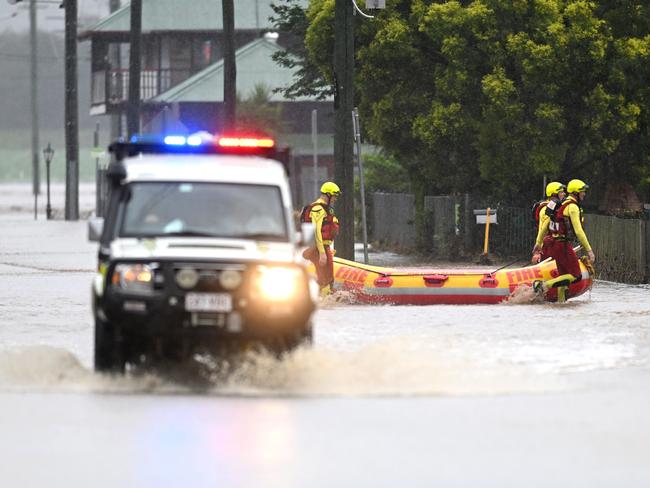 A Swift Water Rescue crew make their way through floodwater in Laidley. (Photo by Dan Peled/Getty Images)