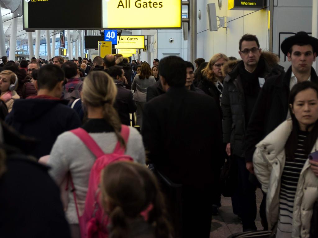 Passengers are waiting in long lines at security in major airports including JFK in New York. Picture: Johannes Eisele / AFP