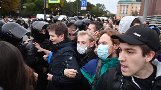 Police officers detain demonstrators in Saint Petersburg on Wednesday following calls to protest against the Russian President’s partial mobilisation. Picture: AFP