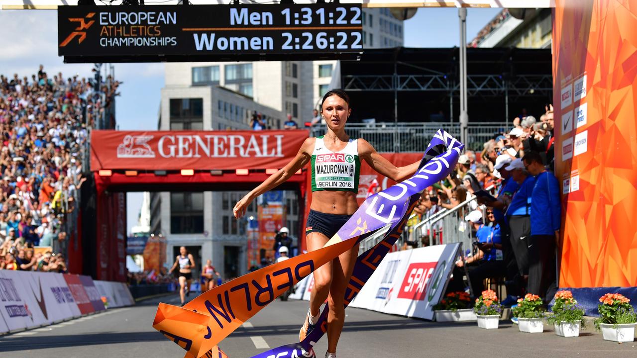 Belarus' Volha Mazuronak crosses the finish line to win the women's marathon.