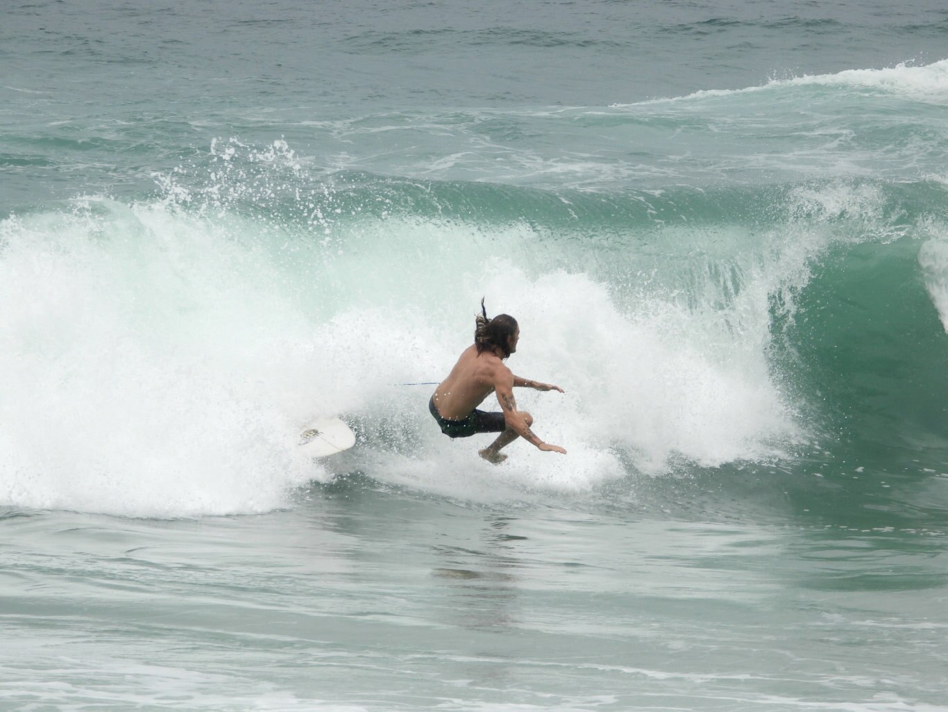 Surfers make the most of the swell times at Pt Cartwright on the Sunshine Coast.