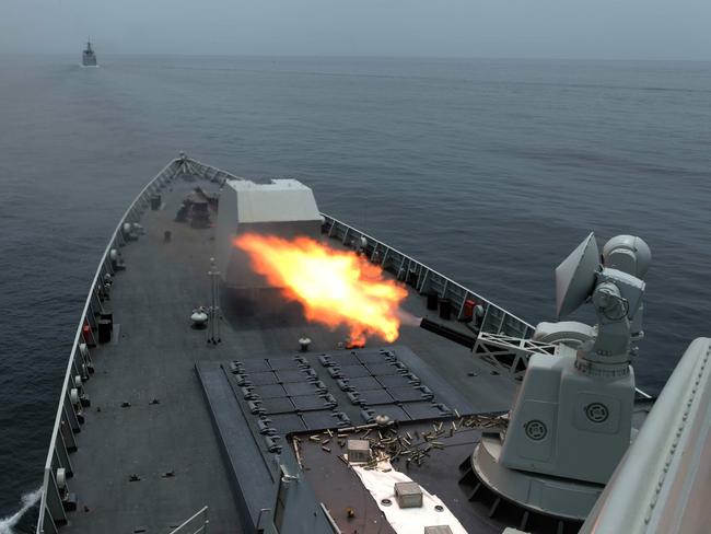A Chinese Type 052D guided missile destroyer tests its antimissile gatling gun during a recent exercise. One of these potent warships is among Beijing's task force in the eastern Indian Ocean. Picture: Xinhua