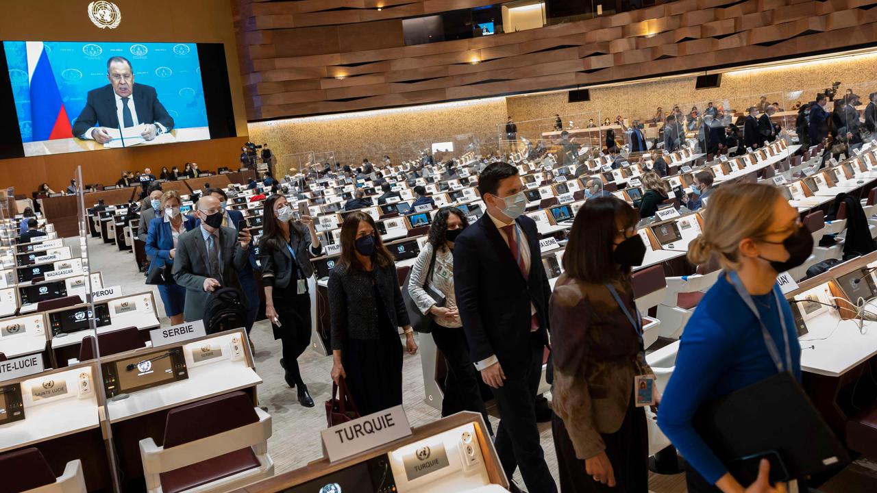 Ambassadors and diplomats leave while Russia's foreign minister Sergei Lavrov (on screen) addresses with a pre-recorded video message at the 49th session of the UN Human Rights Council in Geneva. Picture: SALVATORE DI NOLFI / POOL / AFP