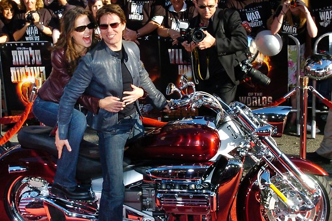 Together on a wild ride ... Katie Holmes and Tom Cruise at the premiere of 'War of the Worlds' where they made their entrance on the red carpet by motorcycle in 2005. Photo: AP