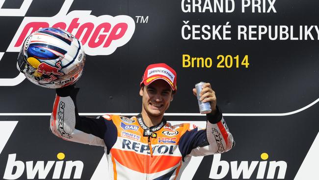 An overjoyed Pedrosa stands victorious on the podium.