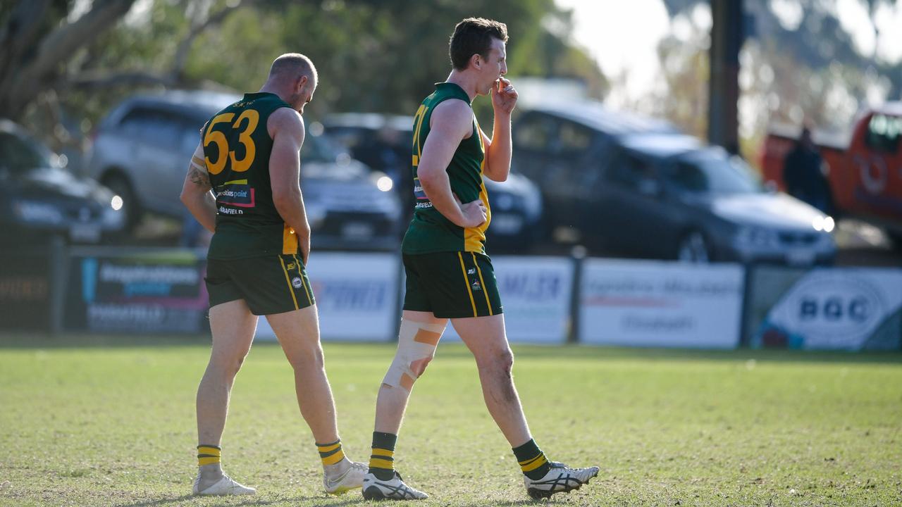 Callum Hay and Corey Reichert walking after Athelstone scores a goal during the Adelaide Footy League division two match between Salisbury North and Athelstone at Salisbury North Oval, Adelaide, Saturday, June 1, 2019. (AAP Image/ Morgan Sette)