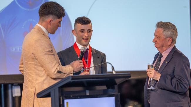 Jake Toeroek (middle) is awarded the John Letts Medal on Saturday night. Picture: Makoto Kaneko