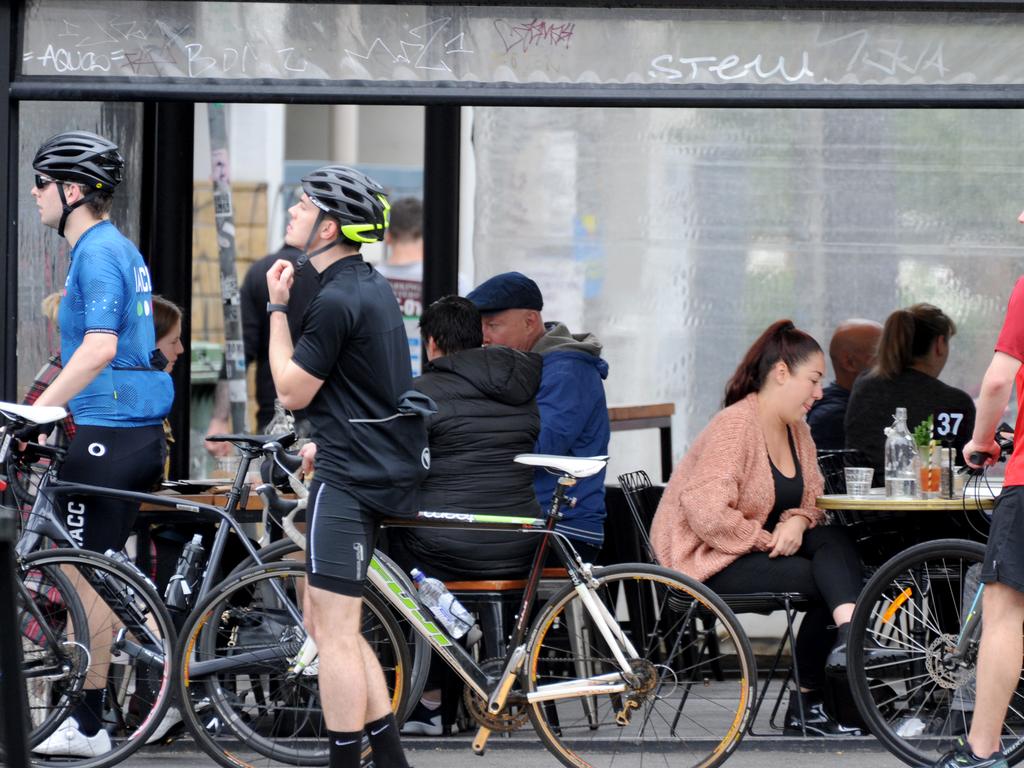 Customers were still ignoring social distancing while at cafes in Melbourne, but that will change under strict new measures. Picture: Andrew Henshaw