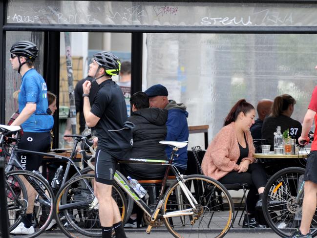 Customers were still ignoring social distancing while at cafes in Melbourne, but that will change under strict new measures. Picture: Andrew Henshaw