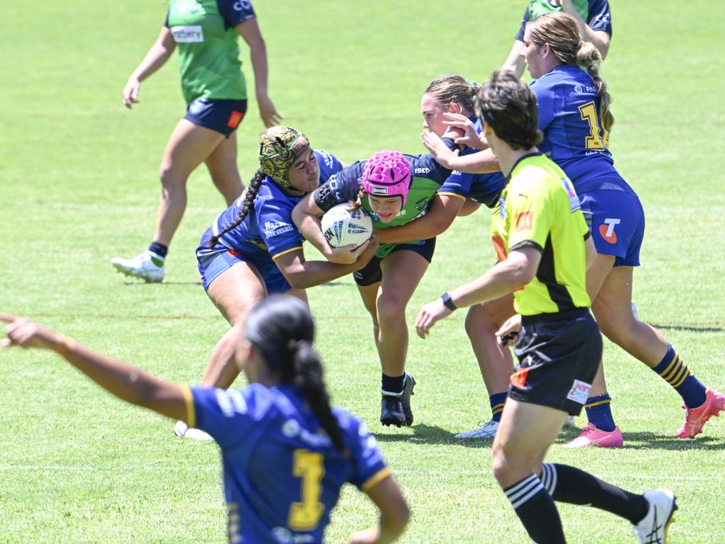 Jade White is tackled by Leonia Vei. Picture: Martin Ollman