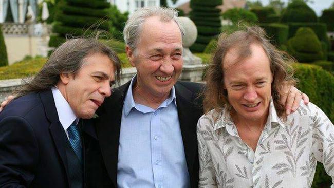 The Young Brothers, AC/DC members Malcolm, left, and Angus, right, with older brother and former Easybeats member George. Photo: Facebook.