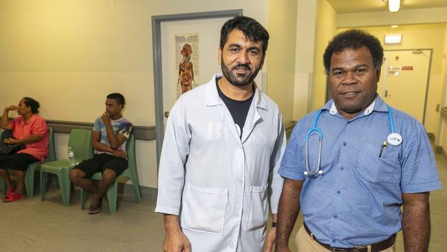 Afghan nurse Mohammad Noor, left, with pediatrician James Auto at Nauru Hospital. Picture: Glenn Hunt