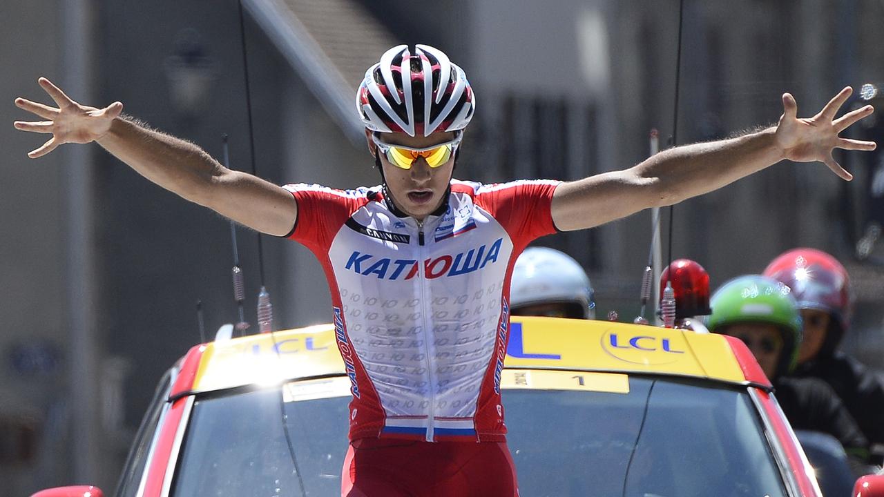 TOPSHOTS Slovenian Simon Spilak celebrates on the finish line after winning the fifth stage (Sisteron - La Mure) of the 66th Dauphine Criterium cycling race on June 12, 2014 La Mure. AFP PHOTO / LIONEL BONAVENTURE