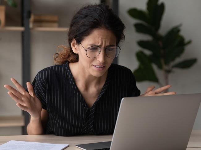 Close up upset businesswoman in glasses having problem with laptop, broken or discharged device, confused unhappy woman looking at computer screen, reading bad news, unexpected debt or spam