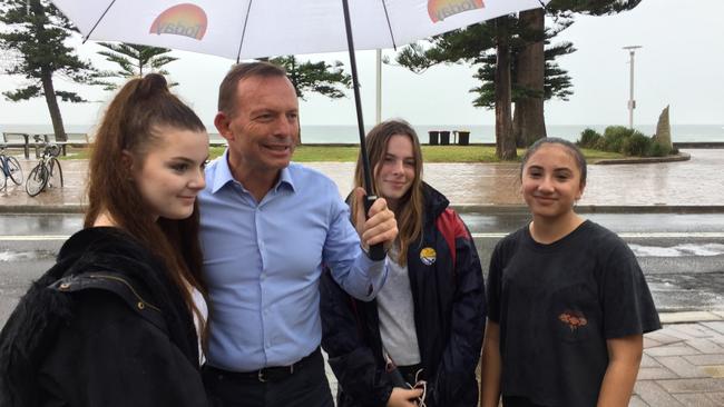 Tony Abbott was seen having coffee at Hemingway’s a few hundred metres away from the protests outside his Manly electorate office.