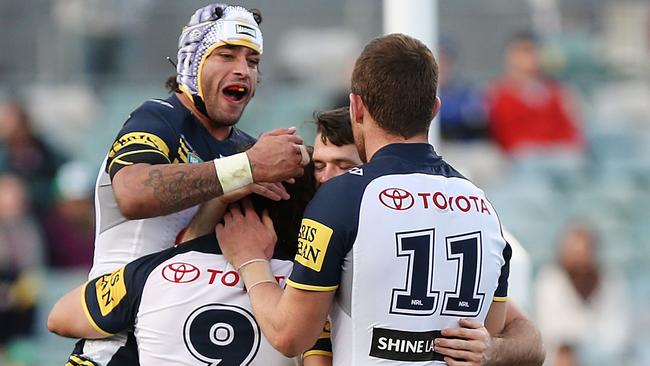 CANBERRA, AUSTRALIA - JUNE 20: Cowboys players celebrate a try during the round 15 NRL match between the Canberra Raiders and the North Queensland Cowboys at GIO Stadium on June 20, 2015 in Canberra, Australia. (Photo by Stefan Postles/Getty Images)