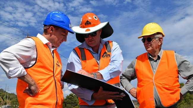 WORK UNDERWAY: Lismore City Council mayor Isaac Smith, SEE Civil project manager Michael Williams and Cr Bill Moorhouse inspect the earthworks of the South Lismore Flood Mitigation project. Picture: Jackie Munro