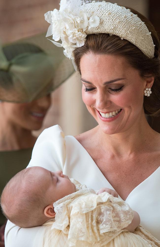 Kate, Duchess of Cambridge beams at a sleeping Louis. Picture: MEGA