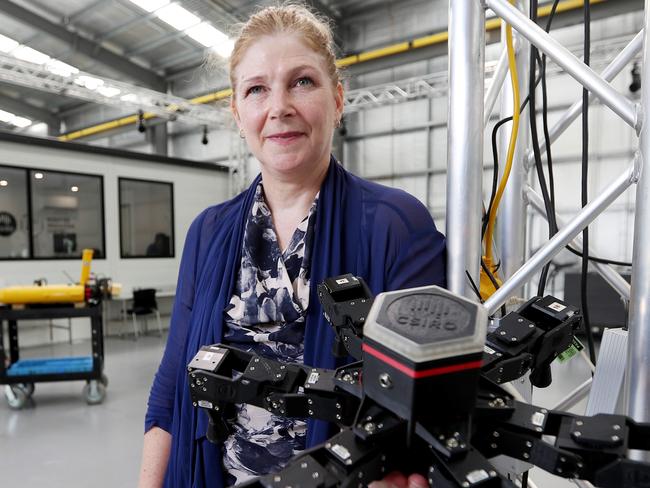 Dr Sue Keay with Gizmo the CSIRO Hexapod in the new Robotics Innovation Centre at Queensland Centre for Advanced Technologies. Pics Tara Croser.