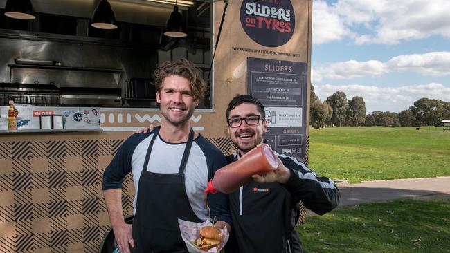 Owen Scungio from Sliders on Tyres with Yarrambat golf course general manager Michael McKay. Picture: Christopher Chan.