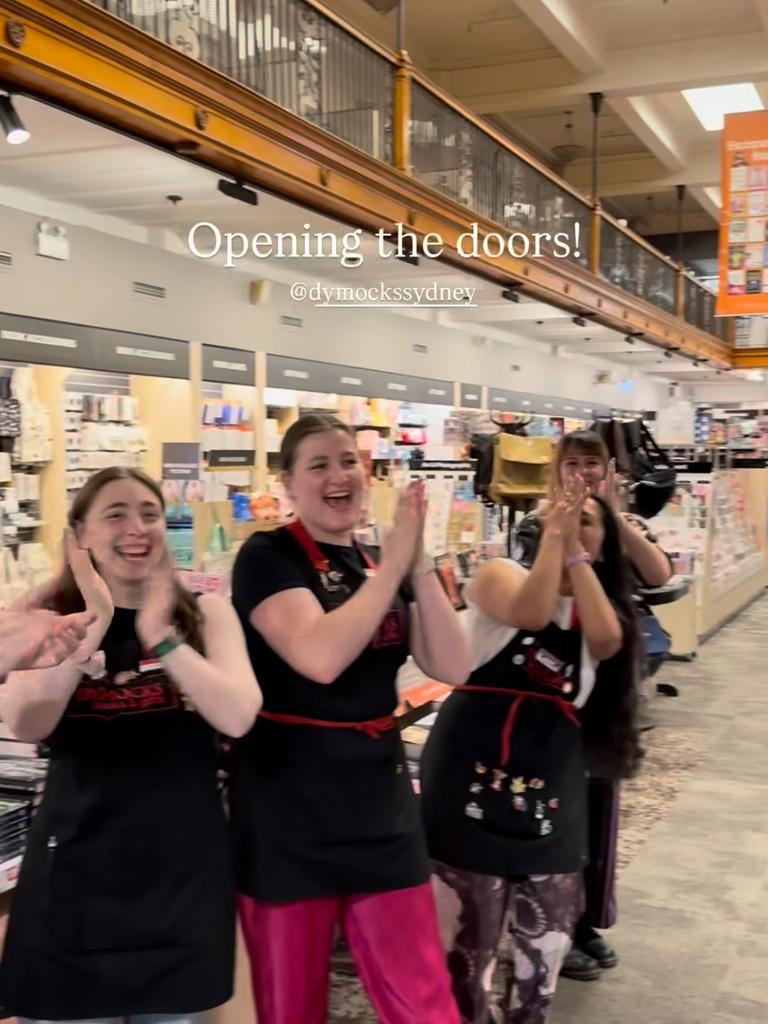 Staff clapped as the doors opened at Dymocks on George St at midnight on Tuesday. Picture: Instagram/@dymocksbooks