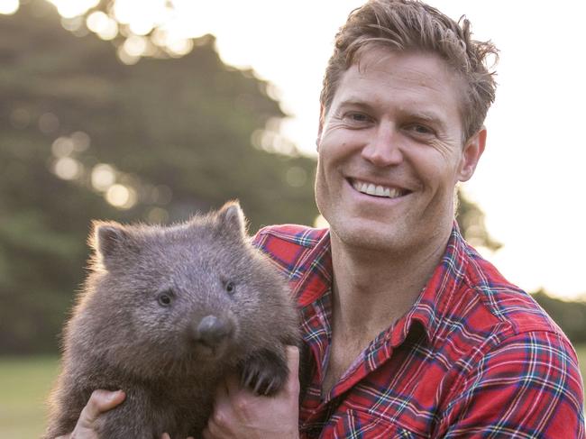 WARNING. SUNDAY TELEGRAPH SPECIAL. PLEASE CONTACT ST PIC ED JEFF DARMANIN BEFORE PUBLISHING. Dr Chris Brown and wombats in Tasmania. Dr Chris has fundraised to help the Wombat population being effected by Mange.  MUST CREDIT Ryan Carter