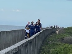 NSW Ambulance personnel at the scene near Hungry Head, Urunga, NSW. Picture: Janine Watson