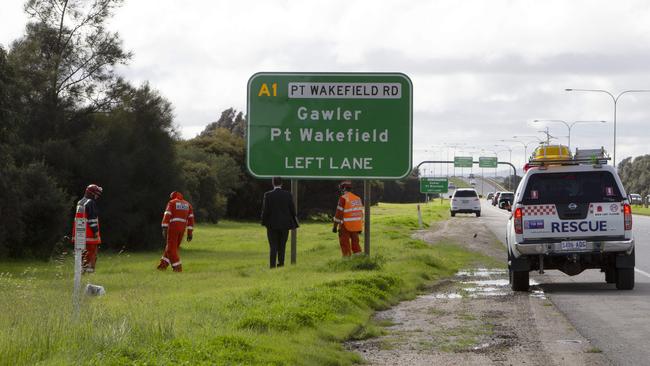 Emergency services personnel at the scene of a terrifying ordeal at Dry Creek on Friday night. Photo: Emma Brasier.