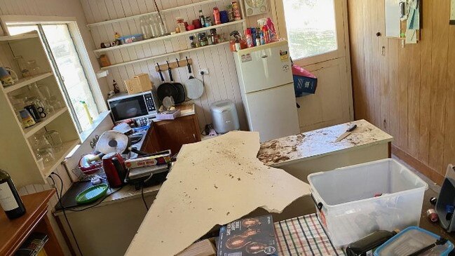 The mess left in Mr Tait's kitchen after two duelling carpet snakes fell through his ceiling.