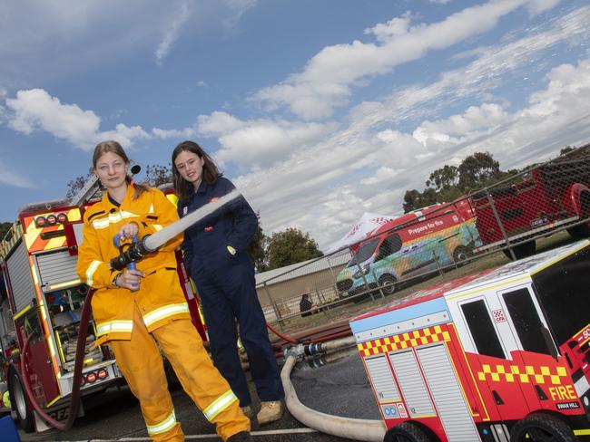 Madi Roberts and Imogen Futter manning the Swan Hill CFA hoses at the Swan Hill Show 2024. Picture: Noel Fisher.