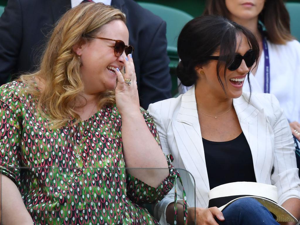 BMeghan was all smiles at the tennis. Picture: AFP