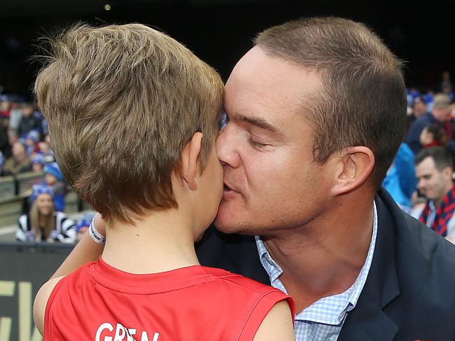 AFL Round 12. 10/06/2019. Big Freeze 5. Collingwood vs Melbourne at the MCG. Brad Green kisses his son Wilba and hugs Oliver after lead the Demons onto the MCG in honour of their mother Anna who passed recently  .  Pic: Michael Klein