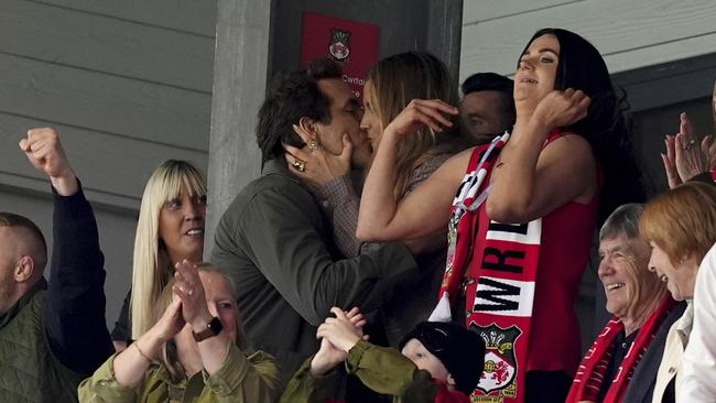 The win was sealed with a kiss. Martin Rickett/PA via AP.