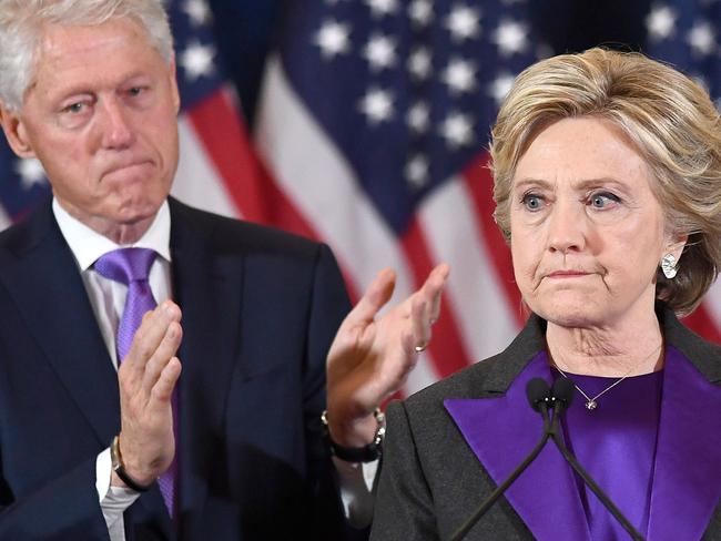 AFP PICTURES OF THE YEAR 2016 US Democratic presidential candidate Hillary Clinton makes a concession speech after being defeated by Republican President-elect Donald Trump, as former President Bill Clinton looks on in New York on November 9, 2016. / AFP PHOTO / JEWEL SAMAD