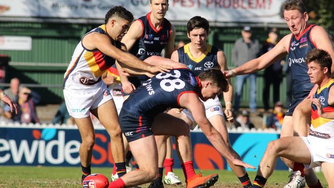 Adelaide's Tyson Stengle works Cole Gerloff off the ball. Picture: Russell Millard/AAP