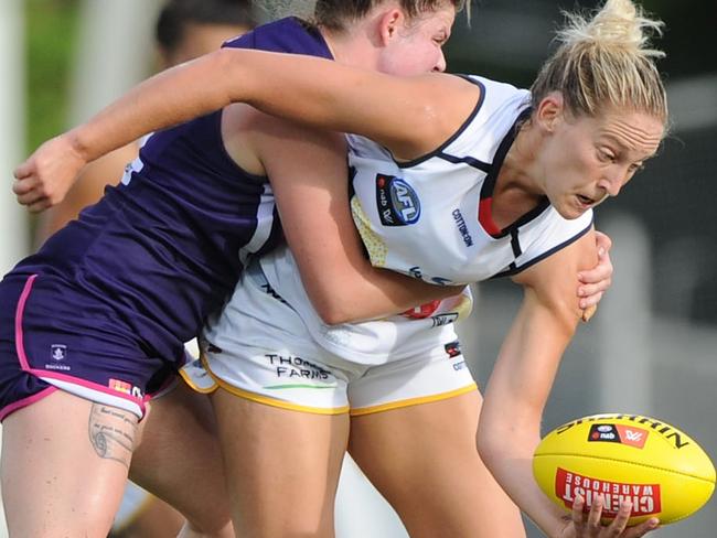 DARWIN, AUSTRALIA - MARCH 9: Marijana Rajcic of the Crows attempts to break a tackle during the 2018 AFLW Round 06 match between the Adelaide Crows and the Fremantle Dockers at TIO Stadium on March 9, 2018 in Darwin, Australia. (Photo by Sean Garnsworthy/AFL Media/Getty Images)