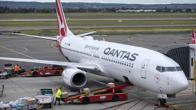 Baggage handlers load luggage onto a Qantas aircraft in Adelaide. Picture: NCA NewsWire