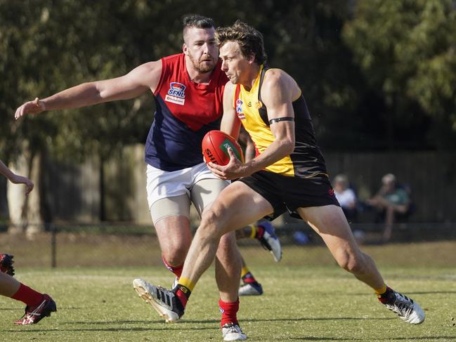 Former Adelaide Crow Myke Cook with the ball for Cheltenham. Picture: Valeriu Campan