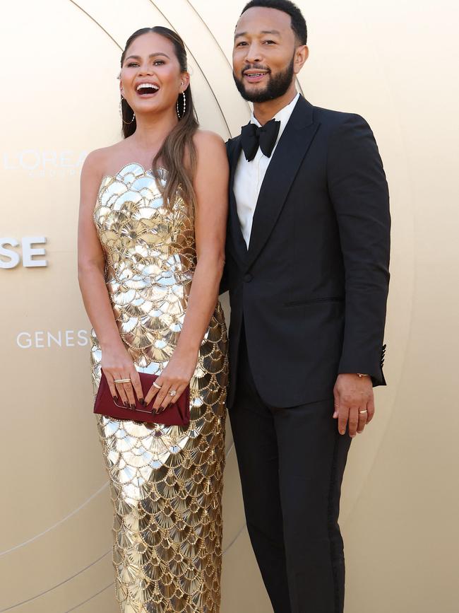 Teigen, seen here with husband John Legend, has always been open with her cosmetic surgery journey. Picture: AFP