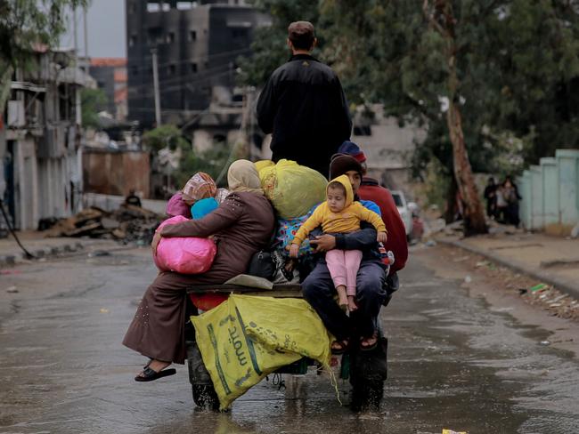 Palestinians transport belongings in Gaza City on the fourth day of a truce between Israel and Hamas. Picture: AFP