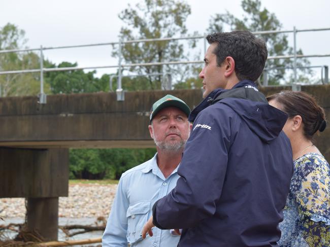 Queensland Premier David Crisafulli and member for Hinchinbrook, Nic Dametto, at the site of Ollera Creek which was damaged by flood waters at the start of February 2025.