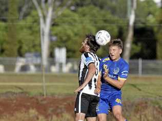 CLOSE RIVALS: Willowburn's Zac Taylor (left) and USQ's Willem Baines compete for the ball during a match earlier this season. The two sides will play in tomorrow's President's Cup final. Picture: Kevin Farmer