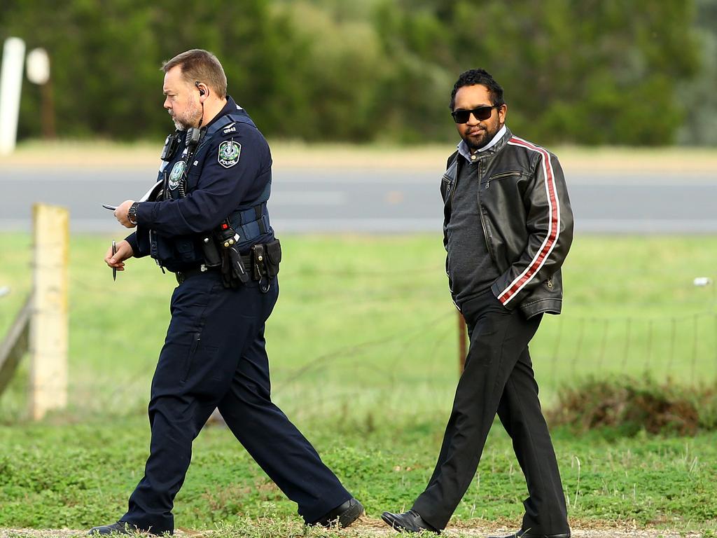 Police and a brother of murder victim Adeline Rigney-Wilson at the Hillier house, a day after the grim discovery. Picture: Tait Schmaal