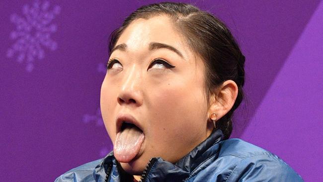 USA's Mirai Nagasu reacts after an Olympic figure skating performance.