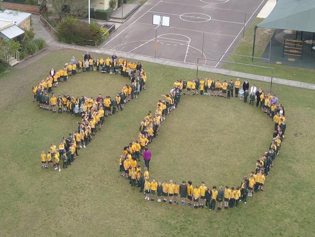 Students and teachers celebrating the 90th anniversary