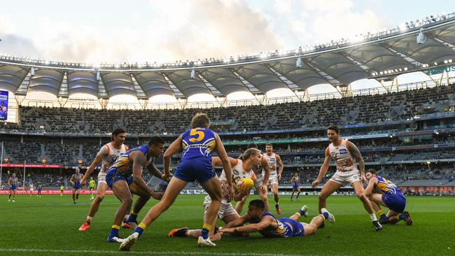 GWS’s Harry Himmelberg handpasses the ball in the loss to West Coast at Optus Stadium in Perth. Picture: Getty Images