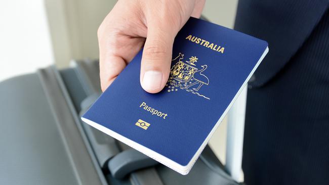 Hands giving passport (of Australia)