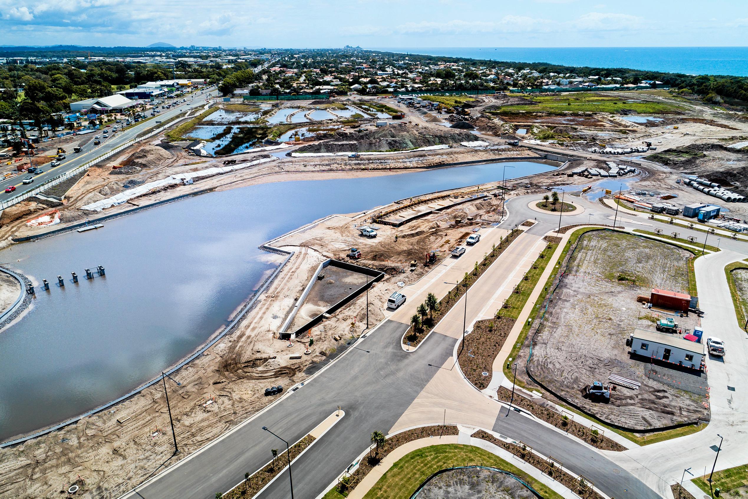 A number of milestones are within reach at Stockland's Oceanside development in Birtinya. Pictured are recent aerial photographs showing housing site and lake development in the Bokarina Beach residential area. Picture: Stockland