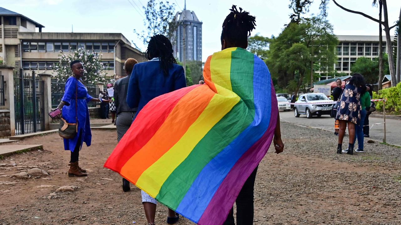 An LGBTQ+ community member wearing a rainbow flag leaves the Milimani high court in Nairobi, Kenya. Picture: Tony Karumba/AFP